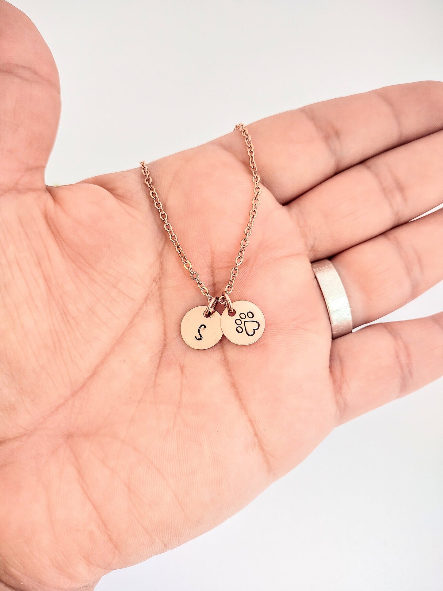 Personalized pet initial with a paw print necklace
