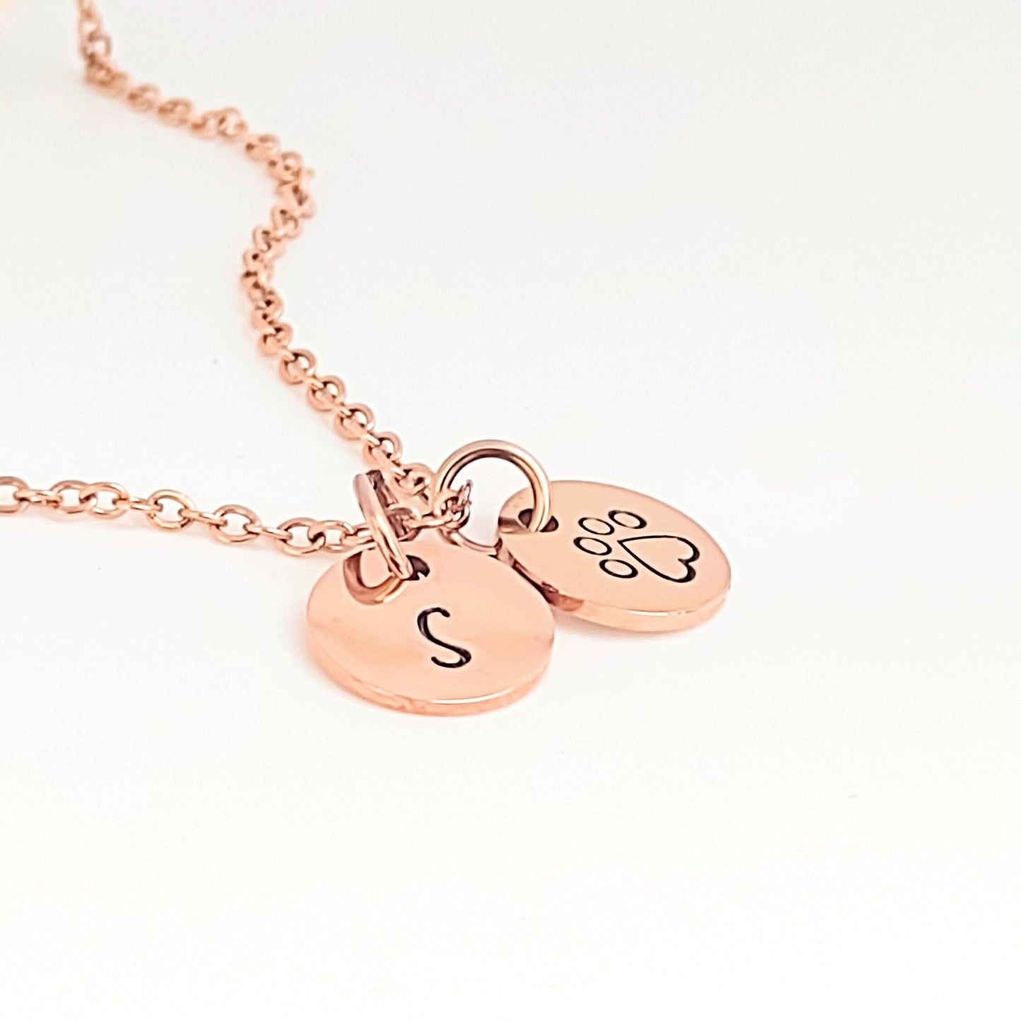 Personalized pet initial with a paw print necklace